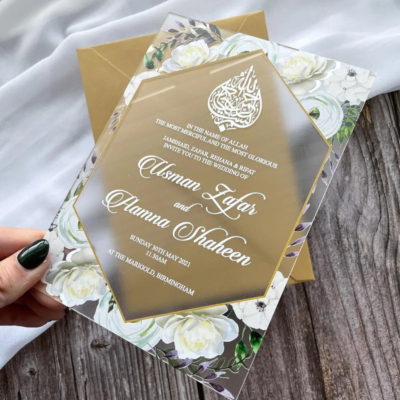 Floral frosted acrylic wedding invitation with gold metallic envelope